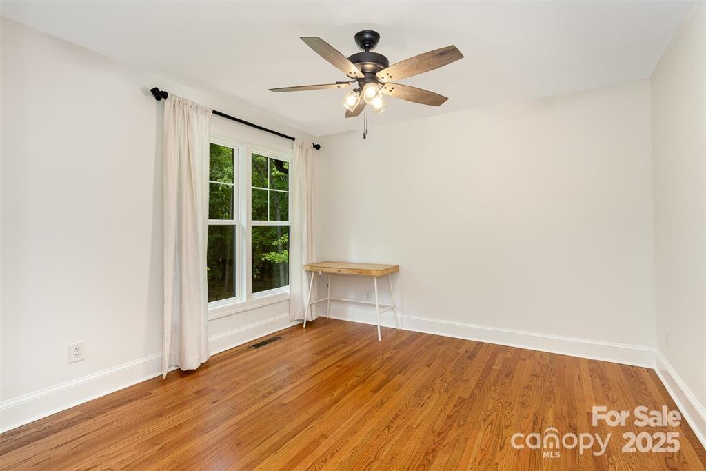 6639 Camp Creek Road Lancaster, SC 29720 - Photo 20 of 42 an empty room with wooden floor fan and windows