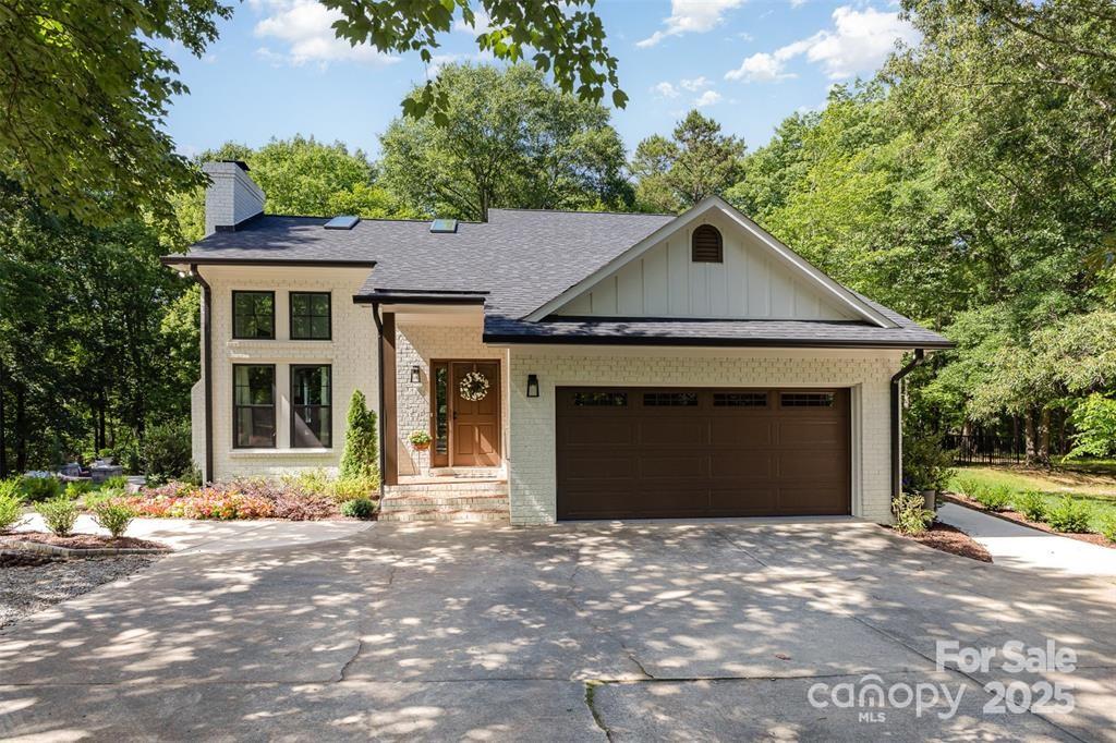 6639 Camp Creek Road Lancaster, SC 29720 - Photo 2 of 42 a front view of a house with a yard and garage
