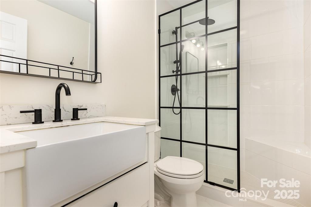 6639 Camp Creek Road Lancaster, SC 29720 - Photo 25 of 42 a kitchen with a sink a toilet and a shower