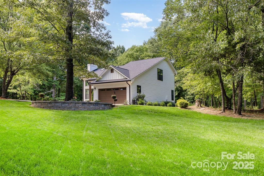 6639 Camp Creek Road Lancaster, SC 29720 - Photo 29 of 42 a front view of a house with garden