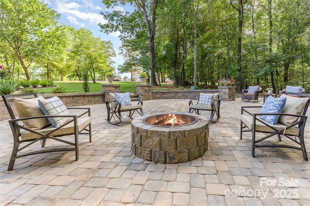 6639 Camp Creek Road Lancaster, SC 29720 - Photo 37 of 42 a view of a chairs and table in backyard of a house