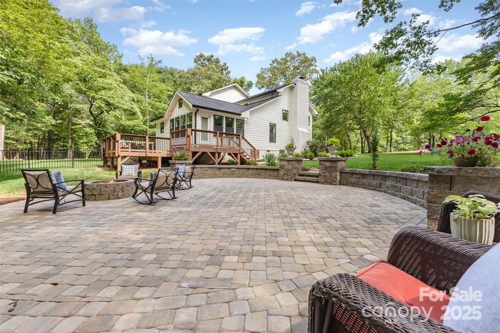 6639 Camp Creek Road Lancaster, SC 29720 - Photo 38 of 42 a view of a patio with a table and chairs under an umbrella