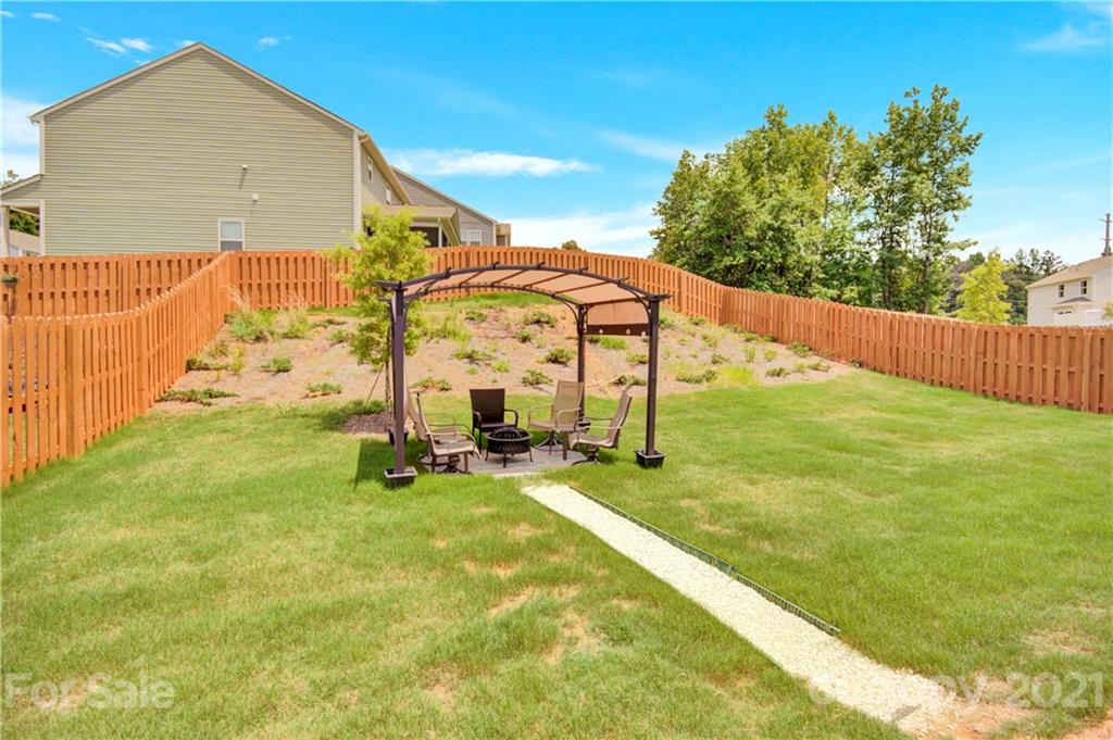 9026 Colwick Hill Road Charlotte, NC 28215 - Photo 20 of 21 a view of a backyard with sitting area
