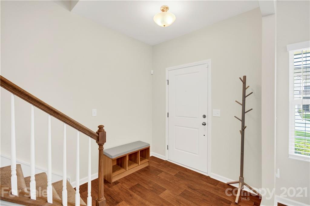9026 Colwick Hill Road Charlotte, NC 28215 - Photo 4 of 21 a view of a livingroom with wooden floor and stairs