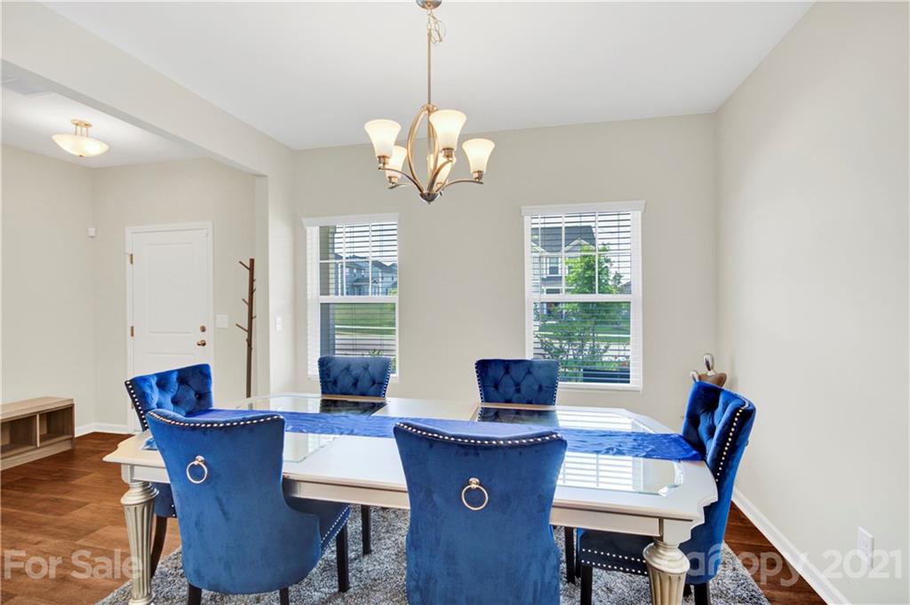 9026 Colwick Hill Road Charlotte, NC 28215 - Photo 5 of 21 a view of a dining room with furniture window and wooden floor