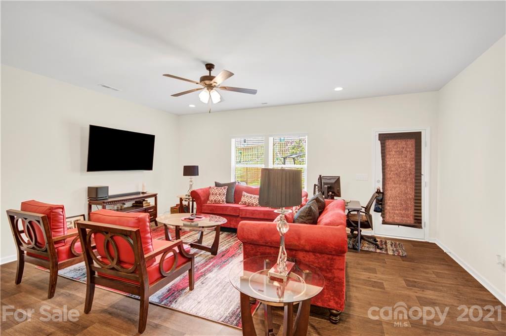 9026 Colwick Hill Road Charlotte, NC 28215 - Photo 10 of 21 a living room with furniture and a flat screen tv