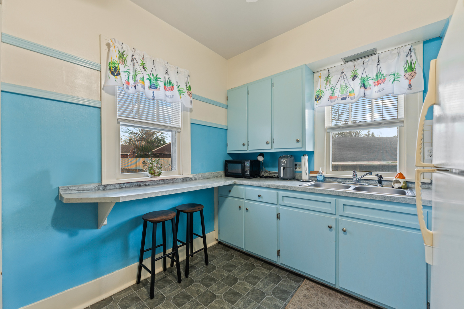 1100 Sycamore Road DeKalb, IL 60115 - Photo 7 of 24 a kitchen with a sink and cabinets