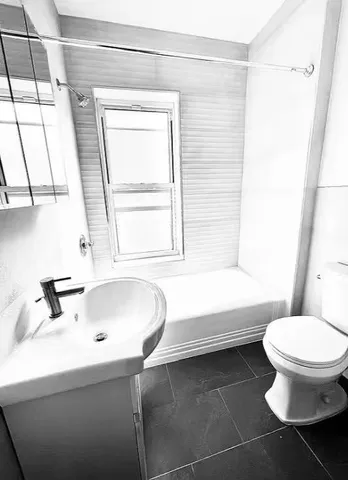 a bathroom with a sink and a toilet