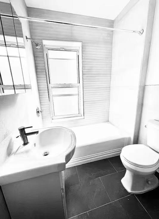 209 Hawthorne Street Brooklyn, NY 11225 - Photo 4 of 4 a bathroom with a sink and a toilet