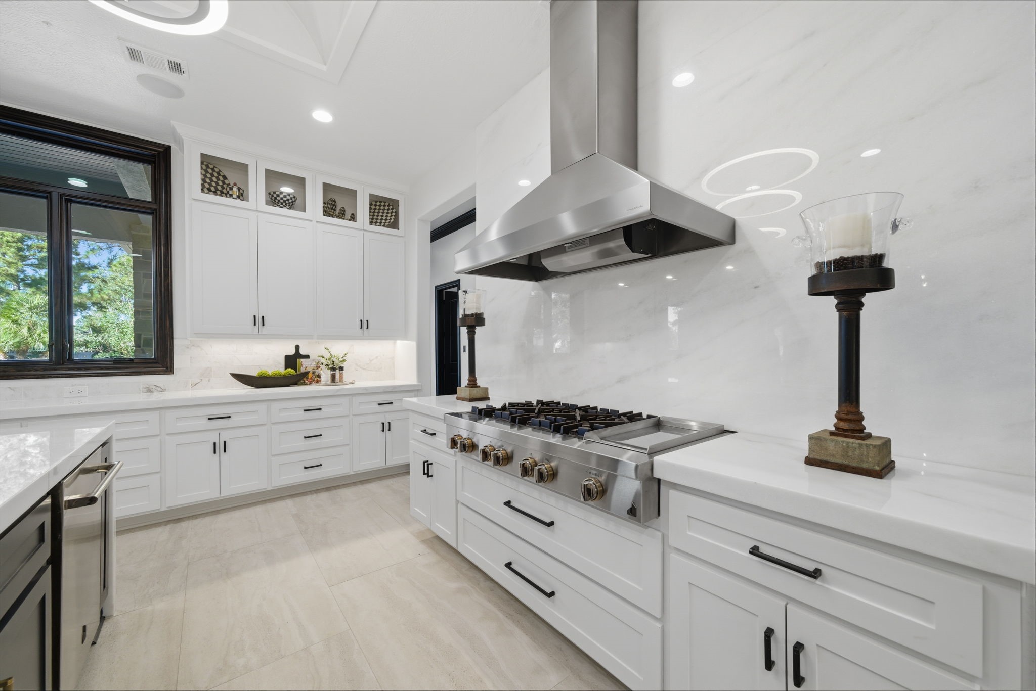 15 Royal King Road Tomball, TX 77377 - Photo 13 of 50 a kitchen with stainless steel appliances granite countertop a sink a stove and a wooden floors
