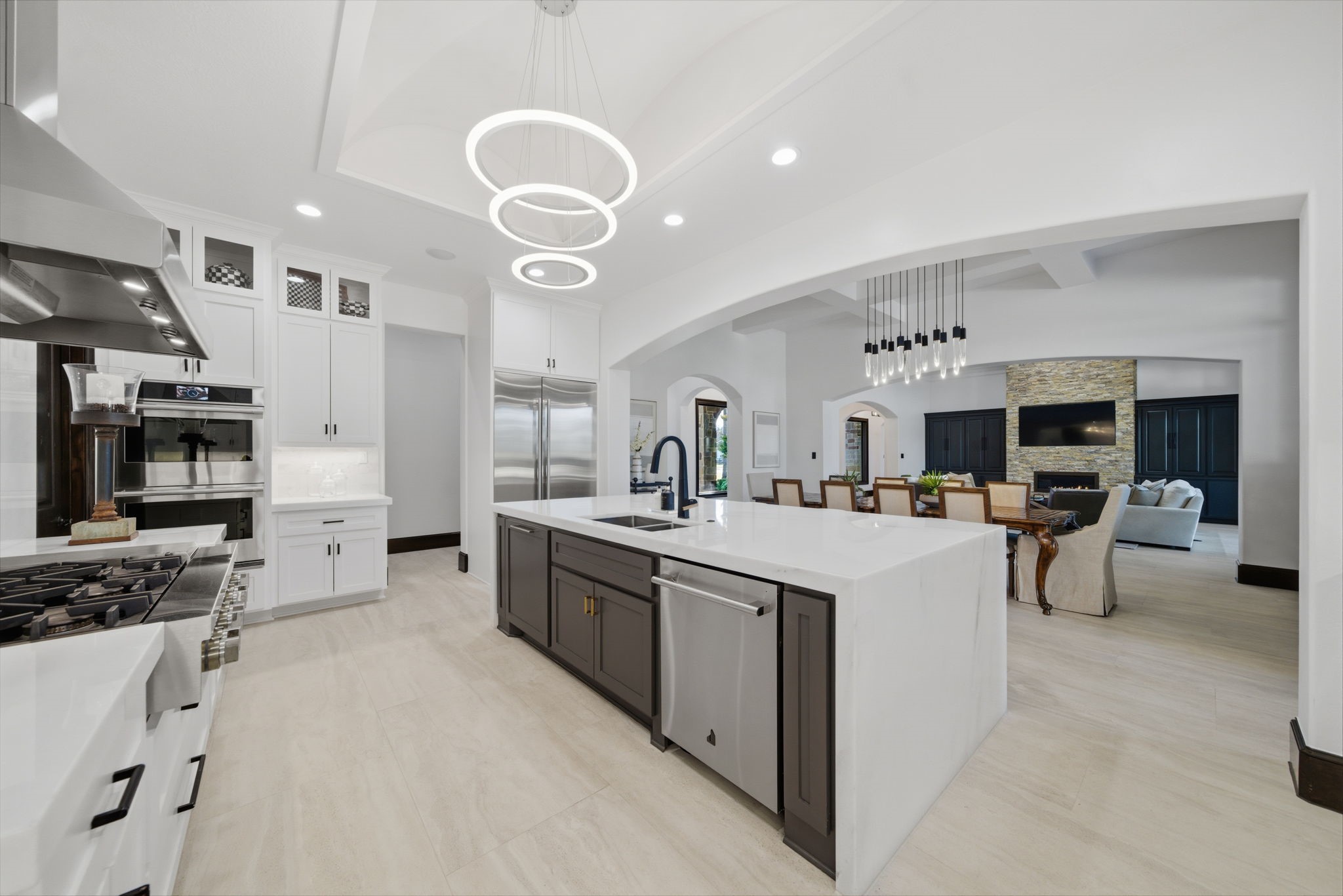 15 Royal King Road Tomball, TX 77377 - Photo 14 of 50 a kitchen with stainless steel appliances granite countertop a sink and white cabinets