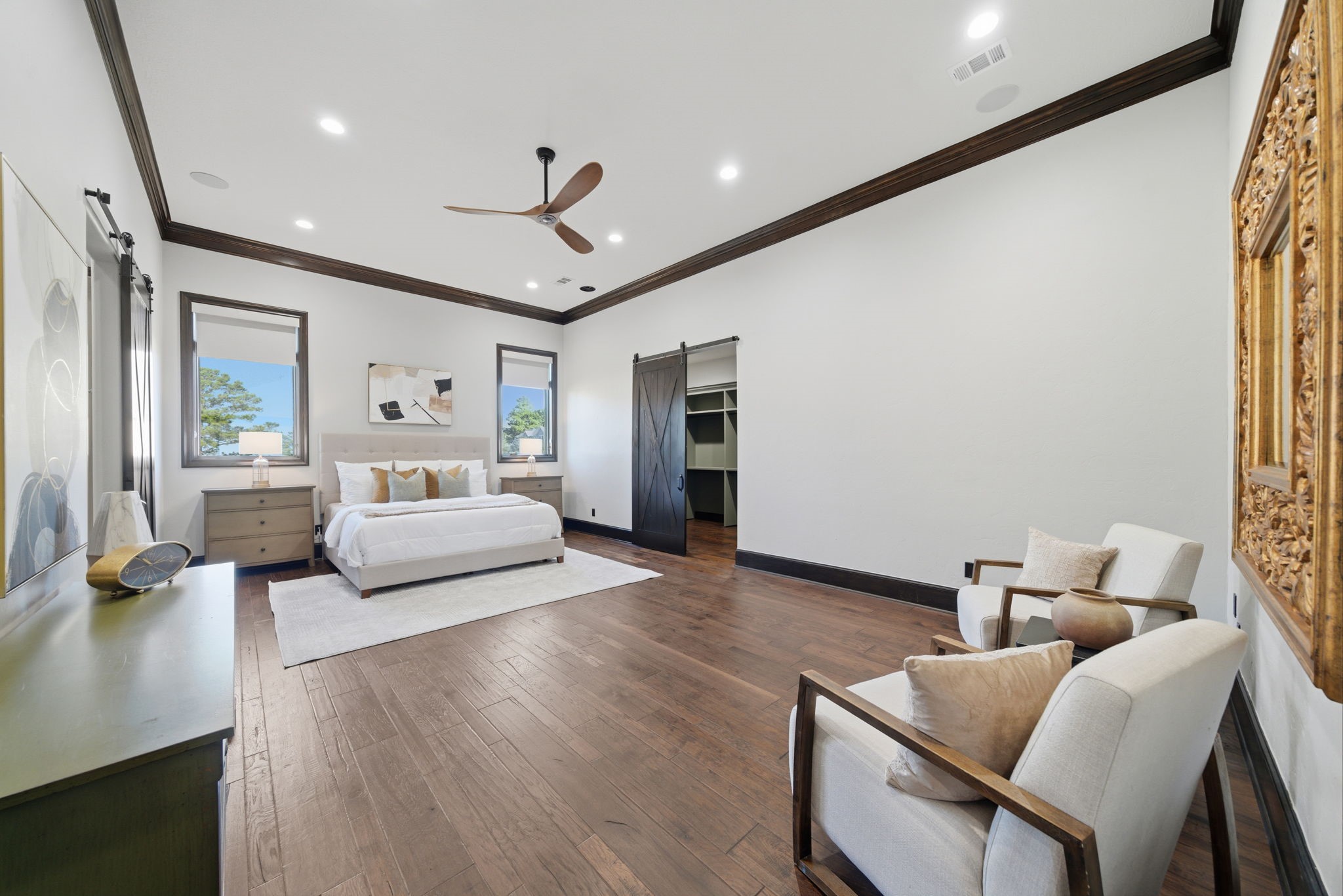 15 Royal King Road Tomball, TX 77377 - Photo 25 of 50 a bedroom with furniture and a chandelier