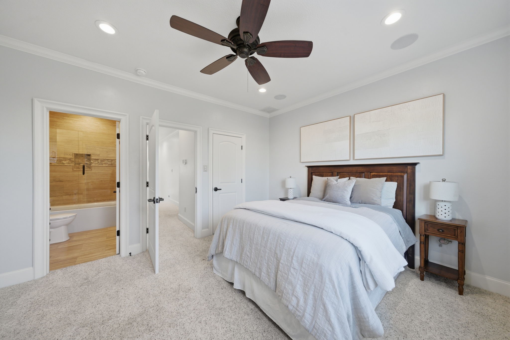 15 Royal King Road Tomball, TX 77377 - Photo 33 of 50 a bedroom with a bed and a ceiling fan