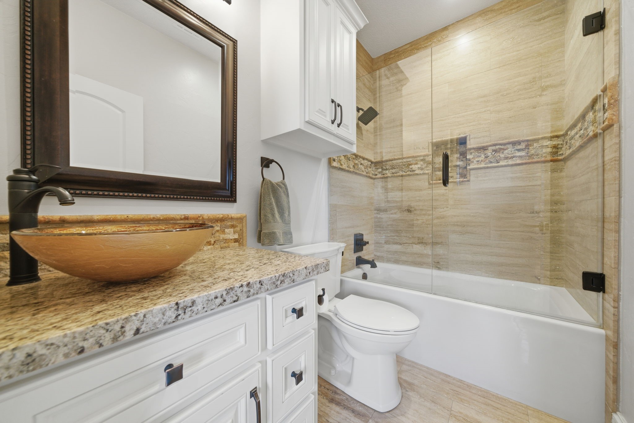 15 Royal King Road Tomball, TX 77377 - Photo 34 of 50 a bathroom with a granite countertop sink and a mirror