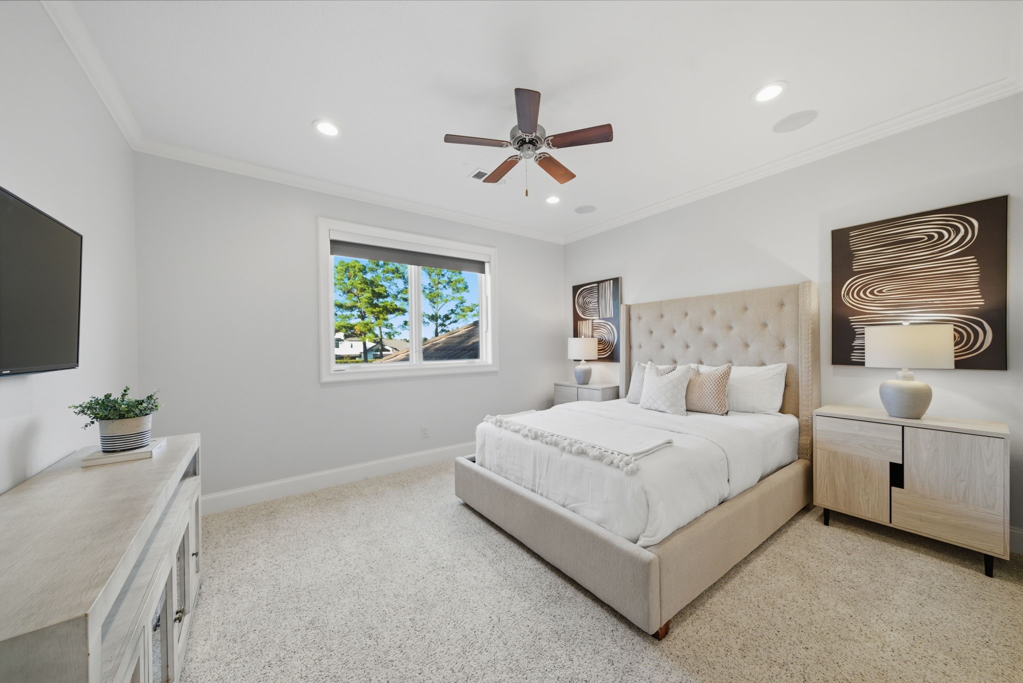 15 Royal King Road Tomball, TX 77377 - Photo 35 of 50 a bedroom with a bed and a flat screen tv