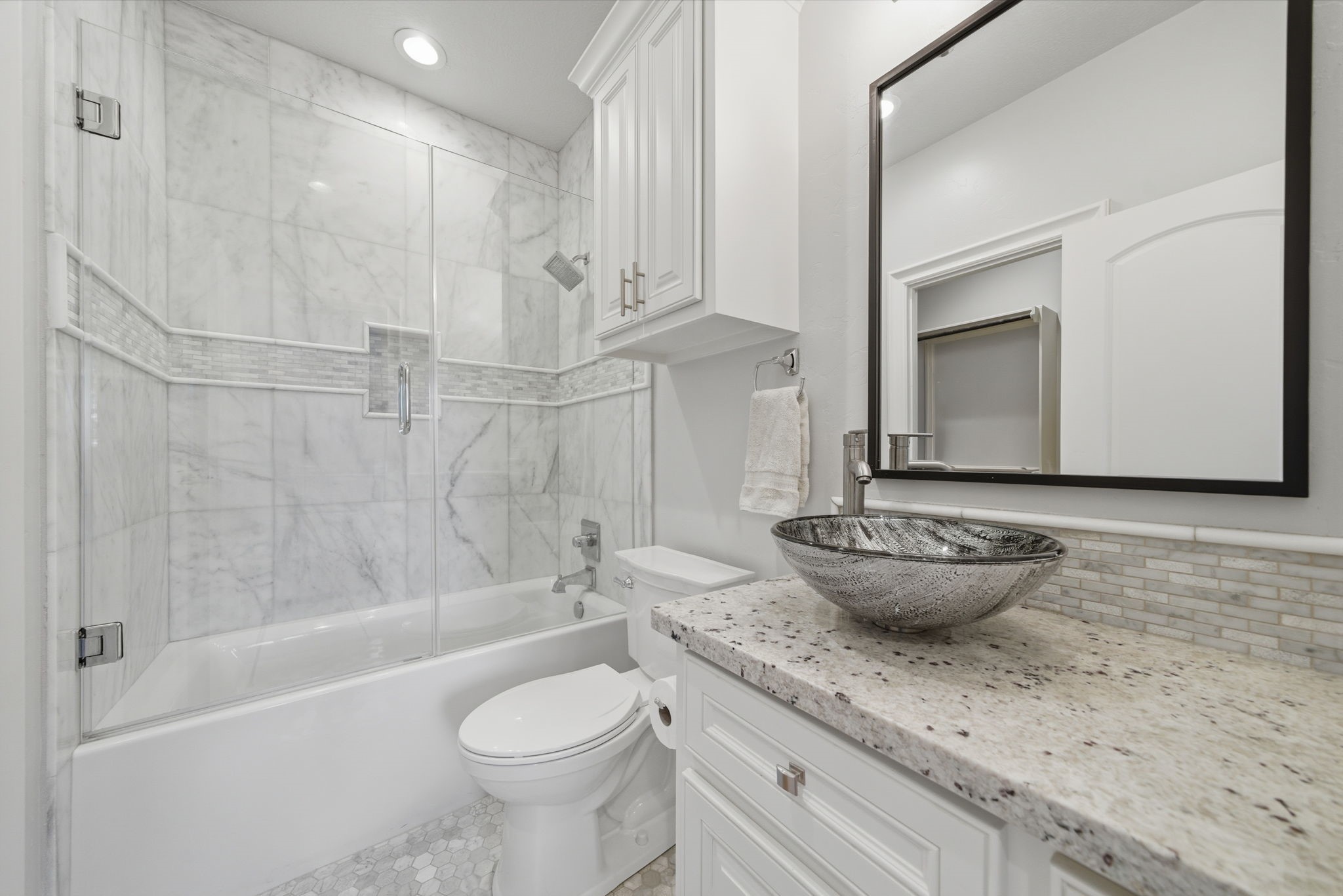 15 Royal King Road Tomball, TX 77377 - Photo 36 of 50 a bathroom with a granite countertop toilet a sink and bathtub