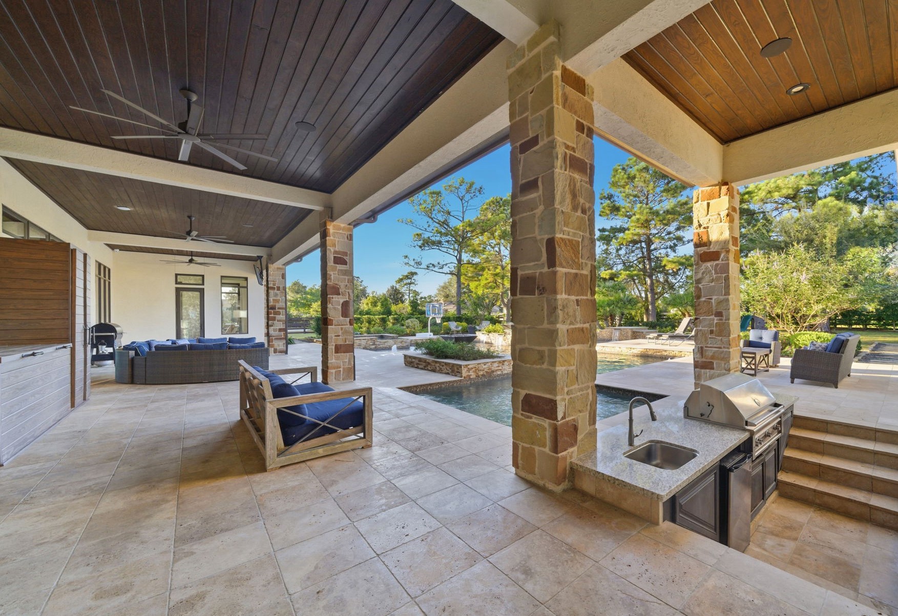 15 Royal King Road Tomball, TX 77377 - Photo 38 of 50 a building outdoor space with patio furniture and potted plants