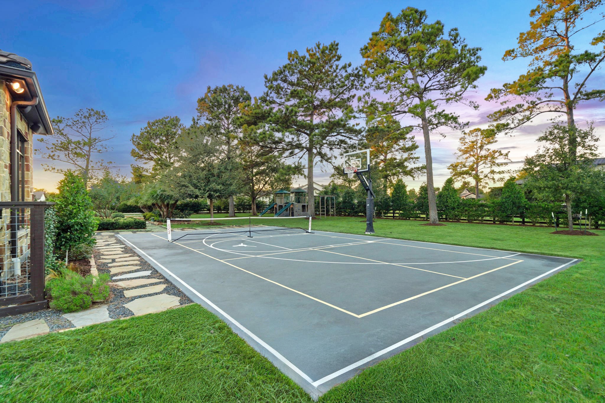 15 Royal King Road Tomball, TX 77377 - Photo 44 of 50 a view of a tennis court