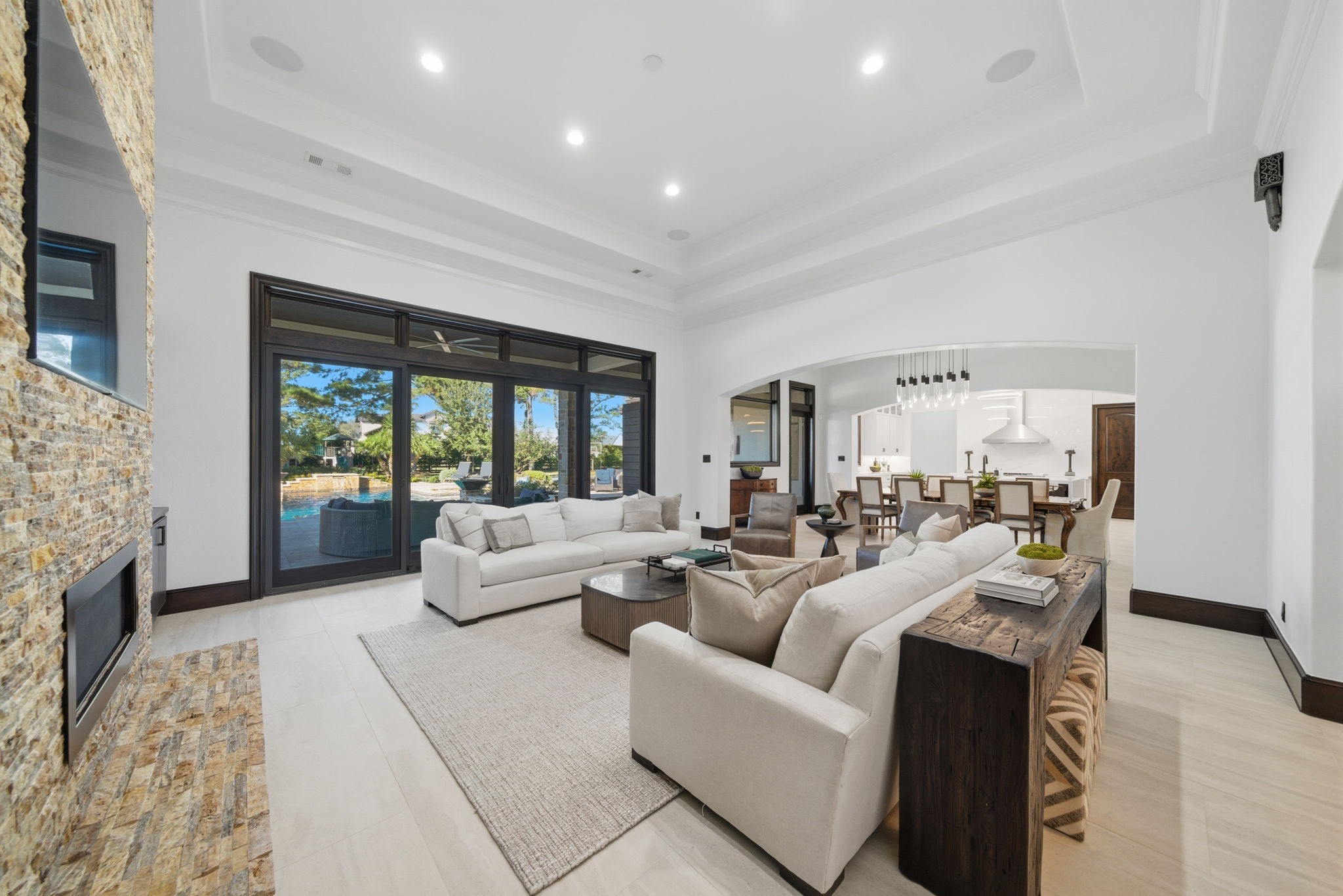 15 Royal King Road Tomball, TX 77377 - Photo 9 of 50 a living room with furniture large window and a fireplace