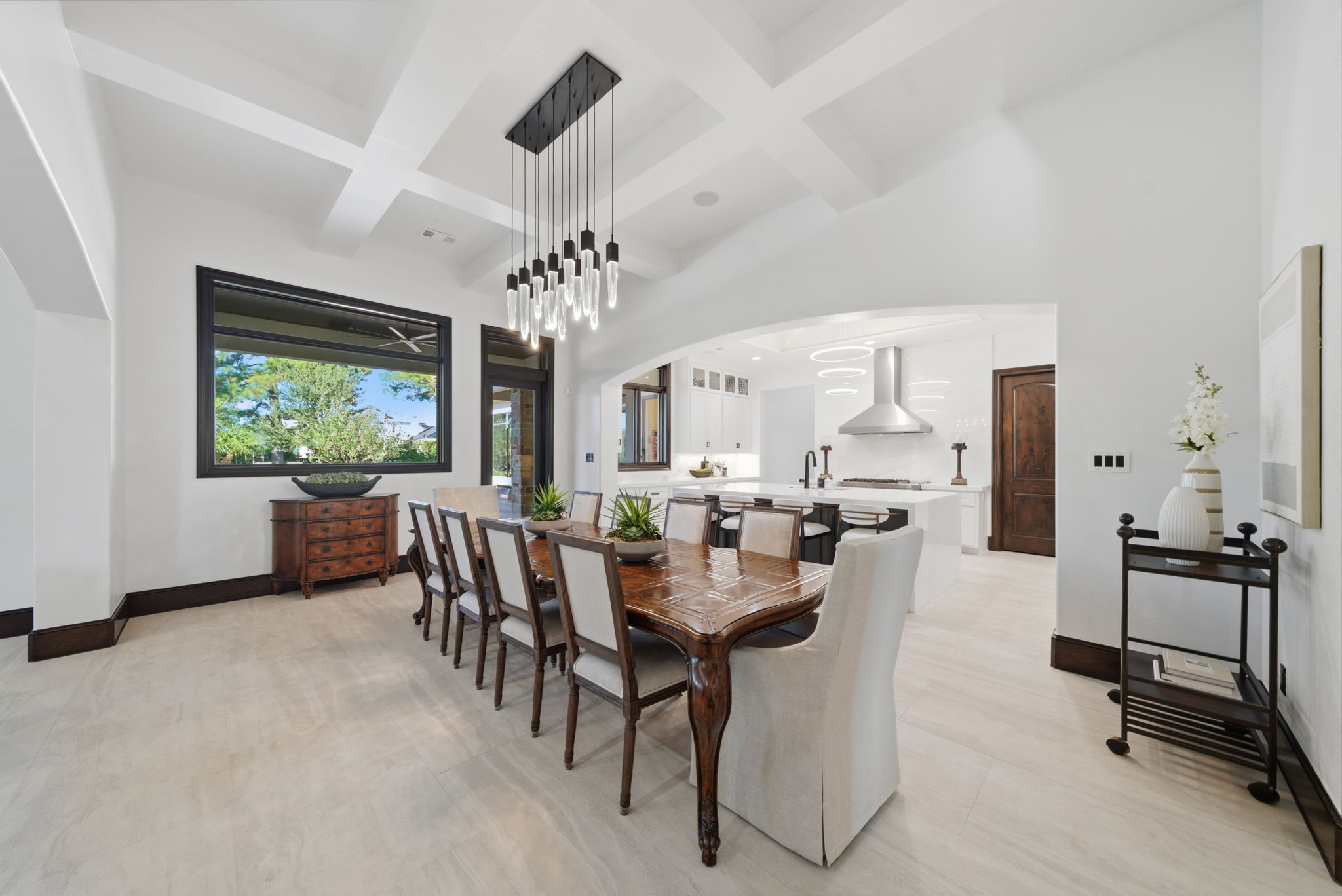 15 Royal King Road Tomball, TX 77377 - Photo 10 of 50 a view of a dining room with furniture a chandelier and a window