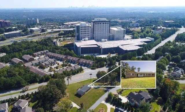 an aerial view of residential houses and city view