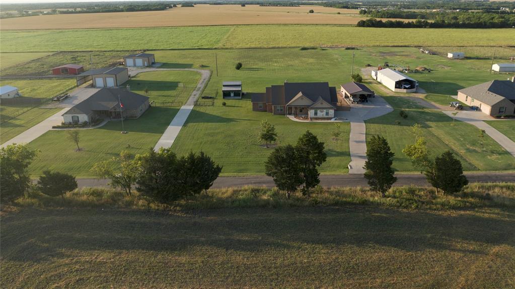 1836 County Road 5005 Blue Ridge, TX 75424 - Photo 27 of 28 Expansive property featuring a central residence, multiple accessory structures, concrete driveways, and manicured lawns