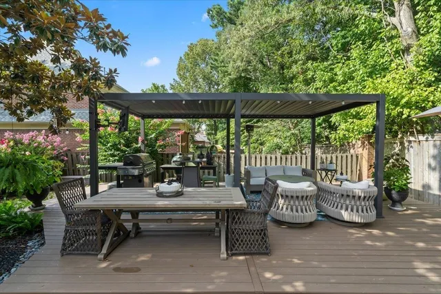 a view of a patio with a table and chairs