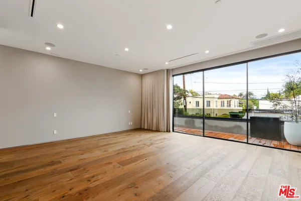 a view of walk in closet and window