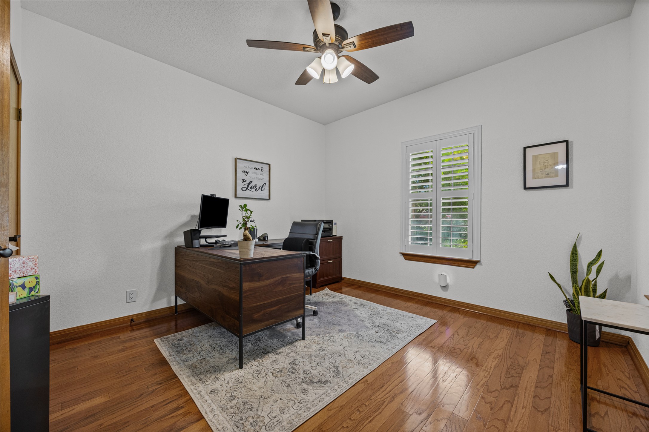 2000 Spinel Road Pflugerville, TX 78660 - Photo 3 of 31 Rich hardwood floors complement a versatile office space, ideal for productivity.