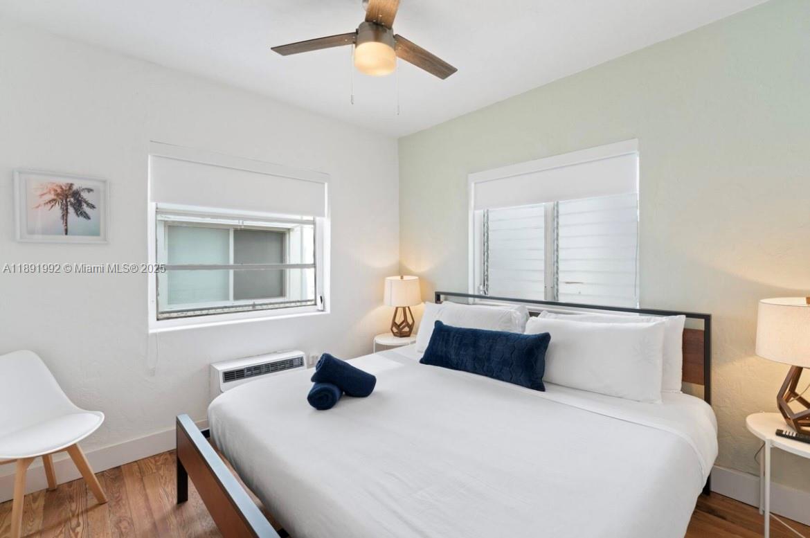 7721 Harding Avenue, Unit 4 Miami Beach, FL 33141 - Photo 11 of 16 a bedroom with a bed and window