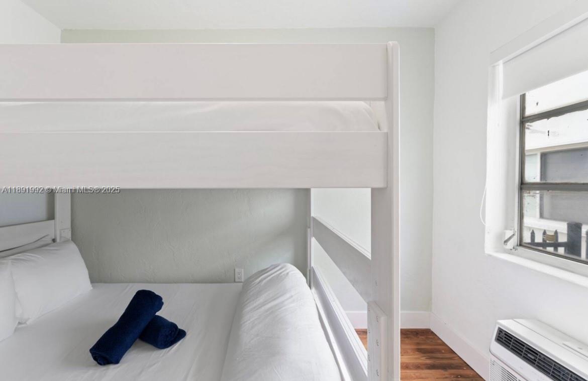 7721 Harding Avenue, Unit 4 Miami Beach, FL 33141 - Photo 15 of 16 a view of staircase with white walls