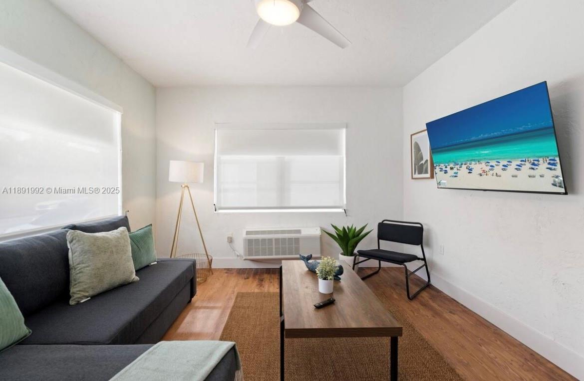 7721 Harding Avenue, Unit 4 Miami Beach, FL 33141 - Photo 3 of 16 a living room with furniture and a rug