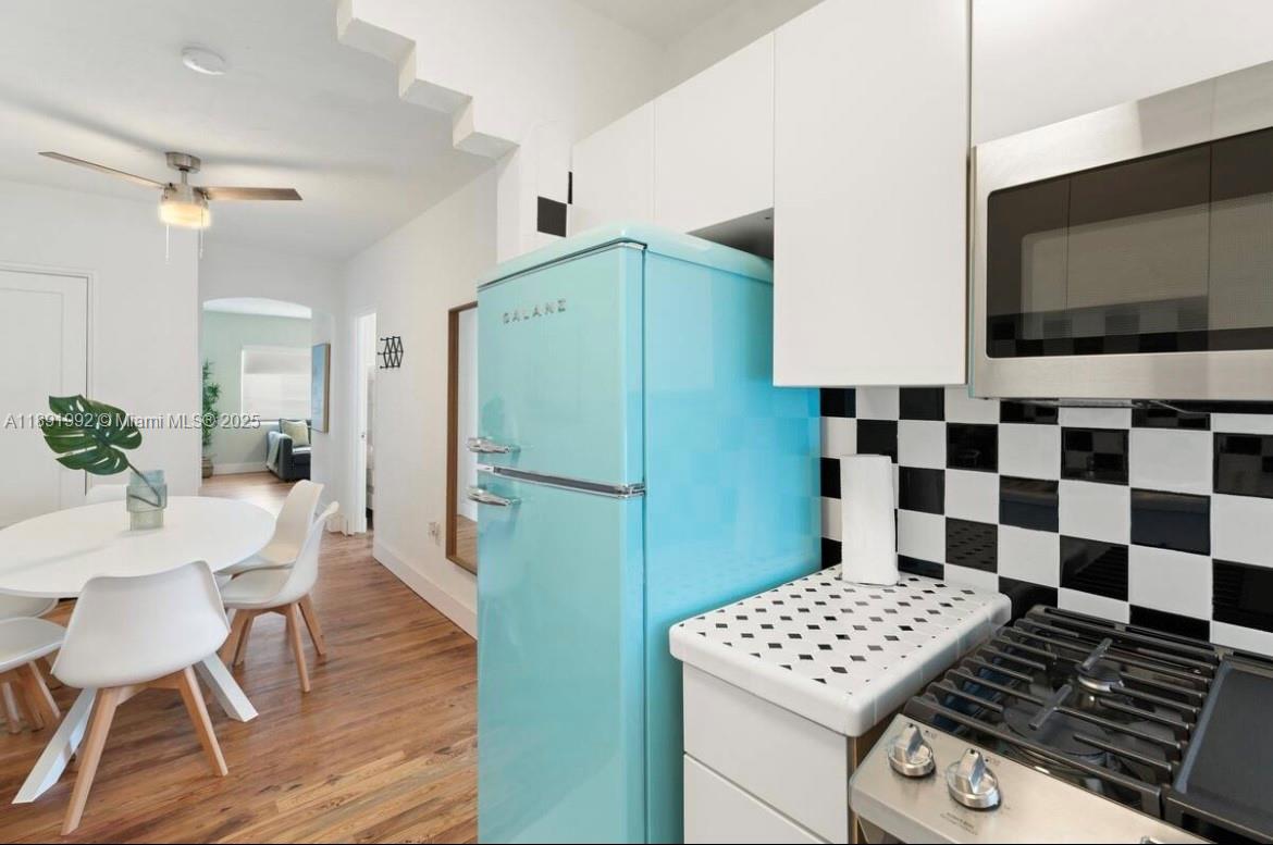 7721 Harding Avenue, Unit 4 Miami Beach, FL 33141 - Photo 7 of 16 a view of bathroom with sink and mirror