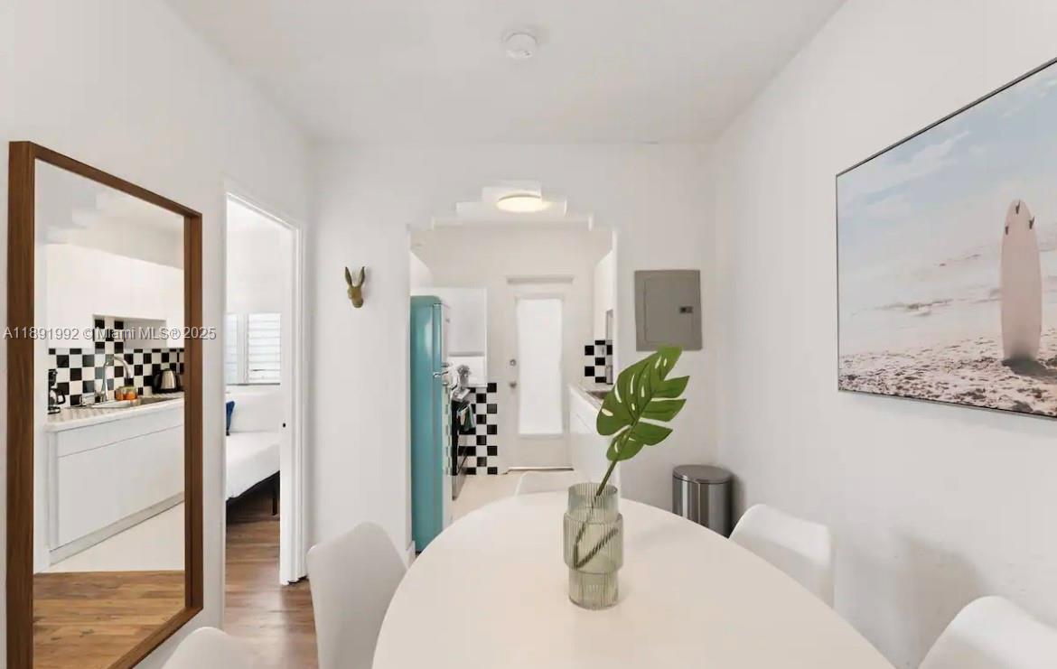 7721 Harding Avenue, Unit 4 Miami Beach, FL 33141 - Photo 8 of 16 a view of a dining room with furniture