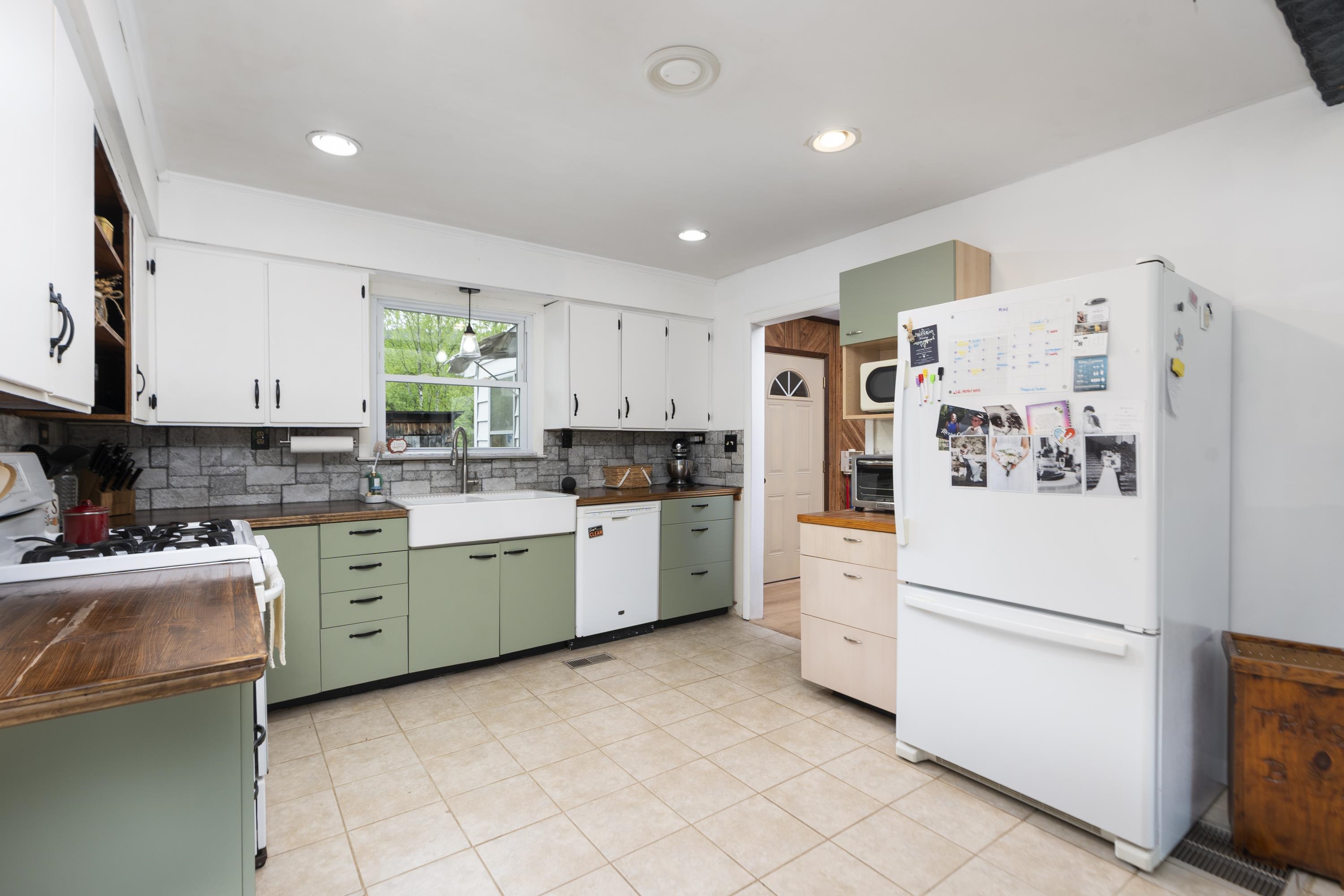 3292 Deerfield Valley Road Deerfield, VA 24432 - Photo 26 of 69 a kitchen with a white cabinets and white appliances