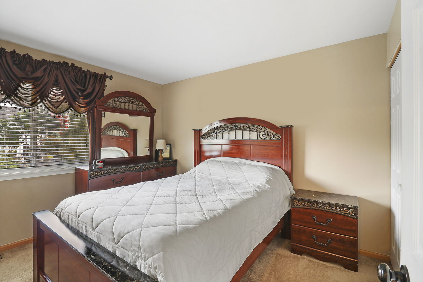 5511 Windgate Way Lake In The Hills, IL 60156 - Photo 16 of 30 a bedroom with a bed and a dresser