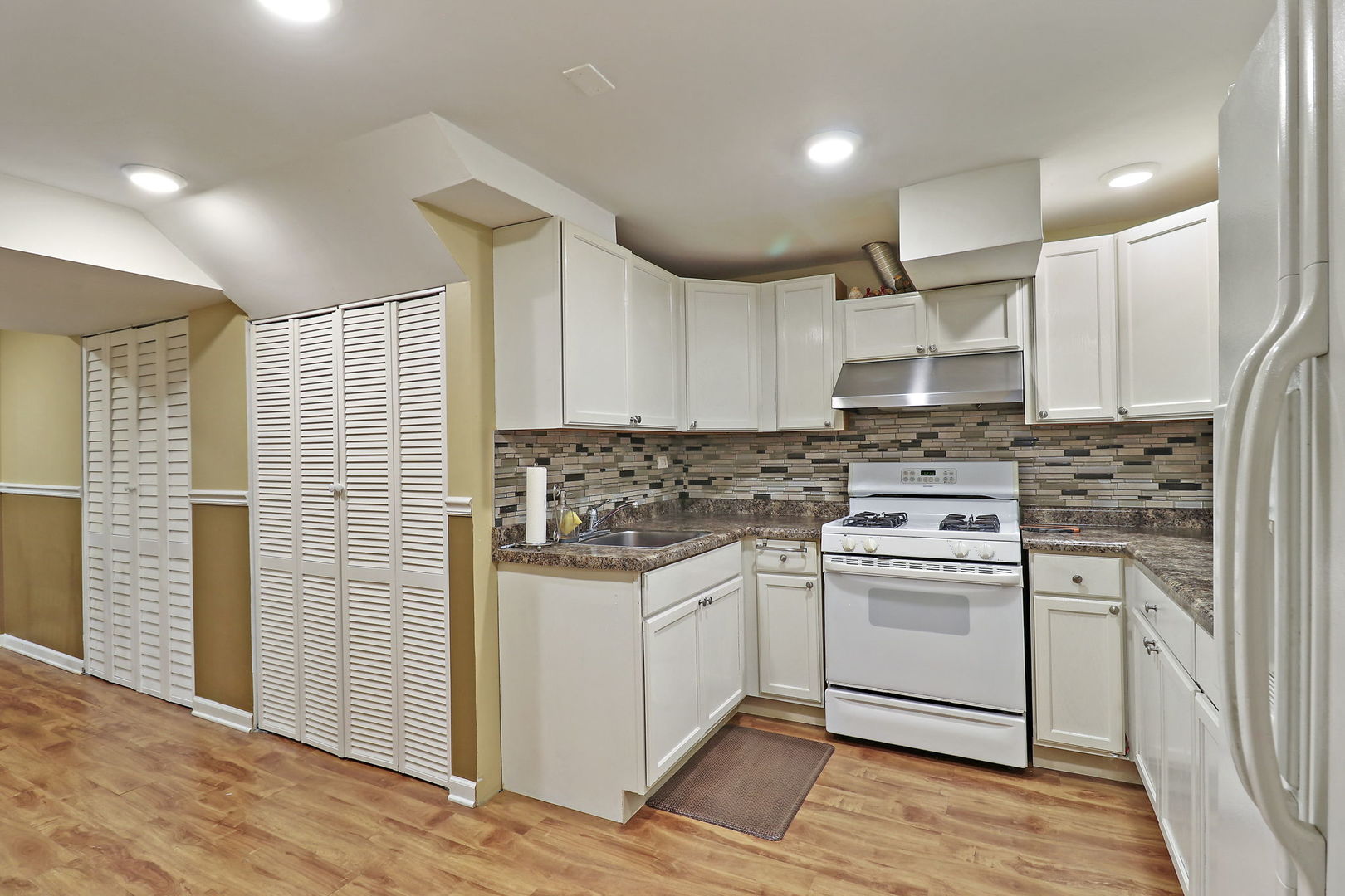 5511 Windgate Way Lake In The Hills, IL 60156 - Photo 23 of 30 a kitchen with a stove a sink and a refrigerator