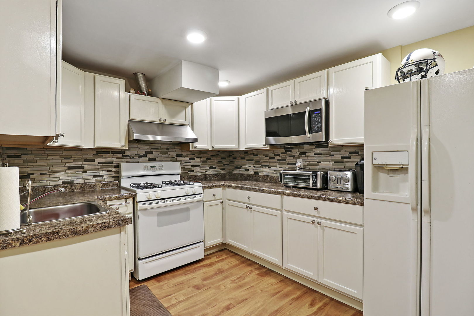 5511 Windgate Way Lake In The Hills, IL 60156 - Photo 24 of 30 a kitchen with stainless steel appliances a sink cabinets and a refrigerator