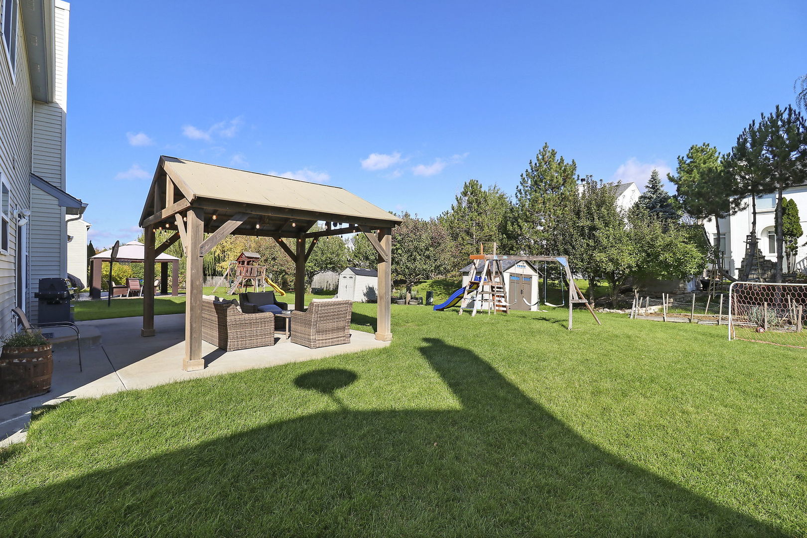 5511 Windgate Way Lake In The Hills, IL 60156 - Photo 29 of 30 a view of a house with backyard and sitting area
