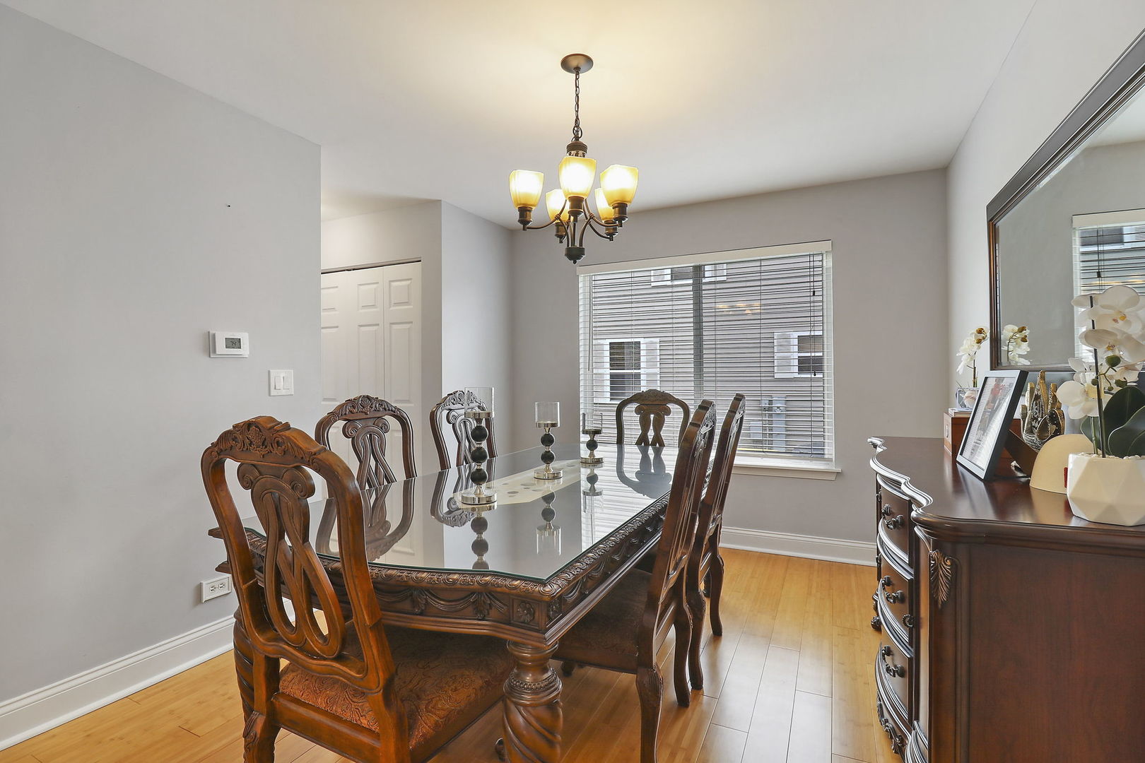 5511 Windgate Way Lake In The Hills, IL 60156 - Photo 5 of 30 a dining room with furniture and chandelier