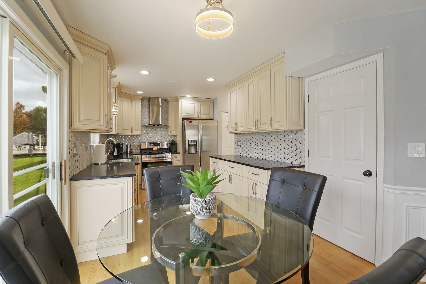 5511 Windgate Way Lake In The Hills, IL 60156 - Photo 9 of 30 a view of kitchen with refrigerator stove dining table and chairs