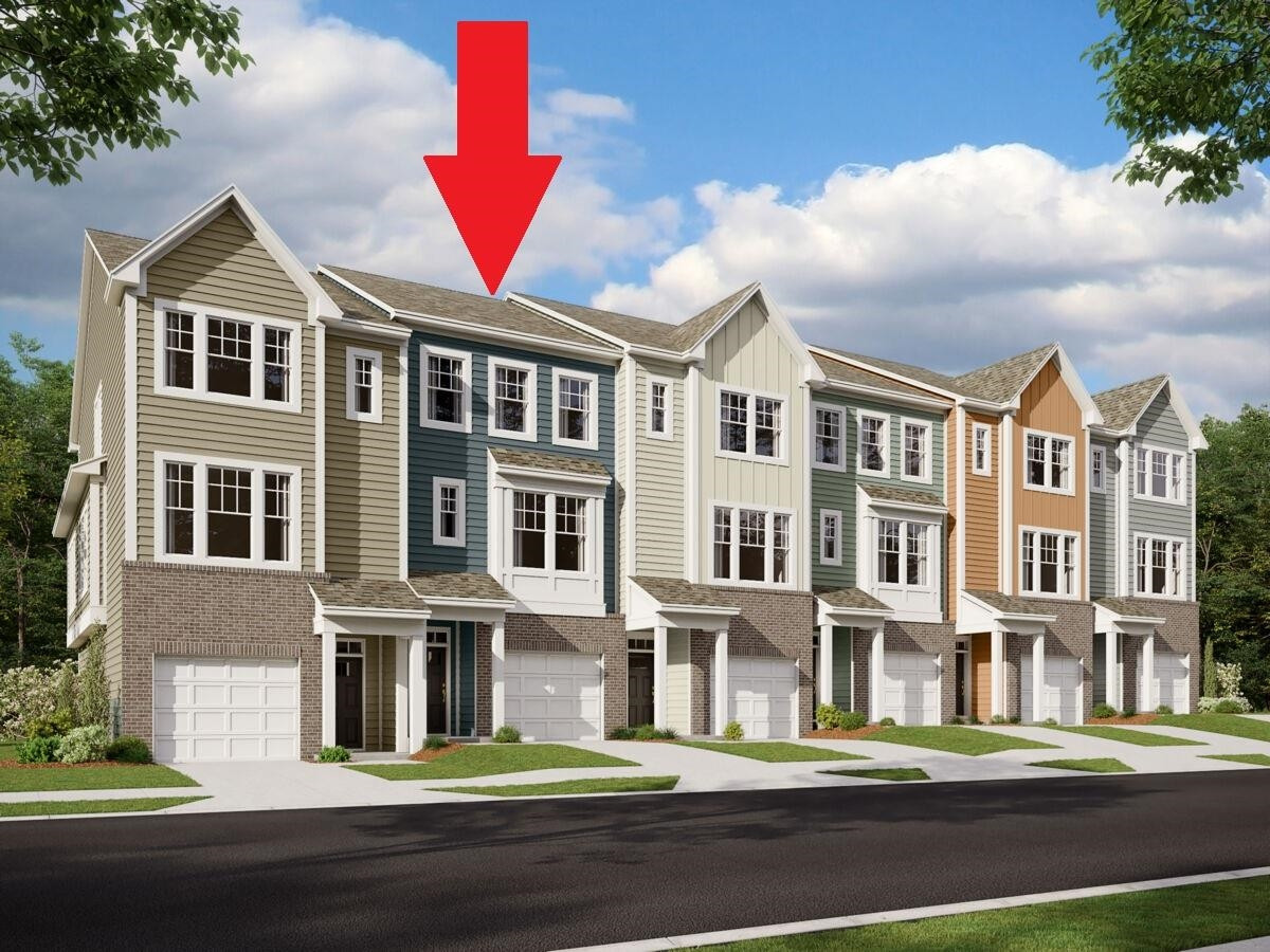 a view of a brick building next to a yard