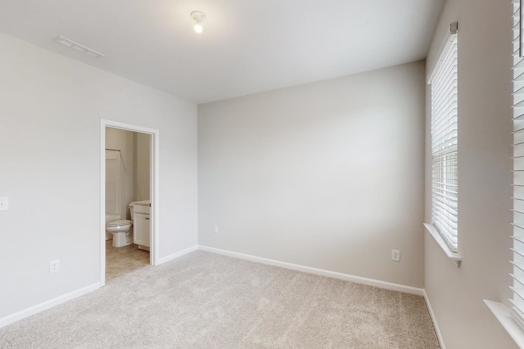 1007 Harmony Trail, Unit 16 Durham, NC 27703 - Photo 19 of 37 a view of an empty room and a window