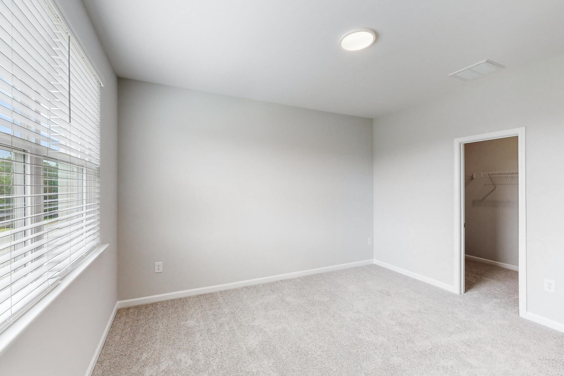 1007 Harmony Trail, Unit 16 Durham, NC 27703 - Photo 26 of 37 a view of an empty room with a window