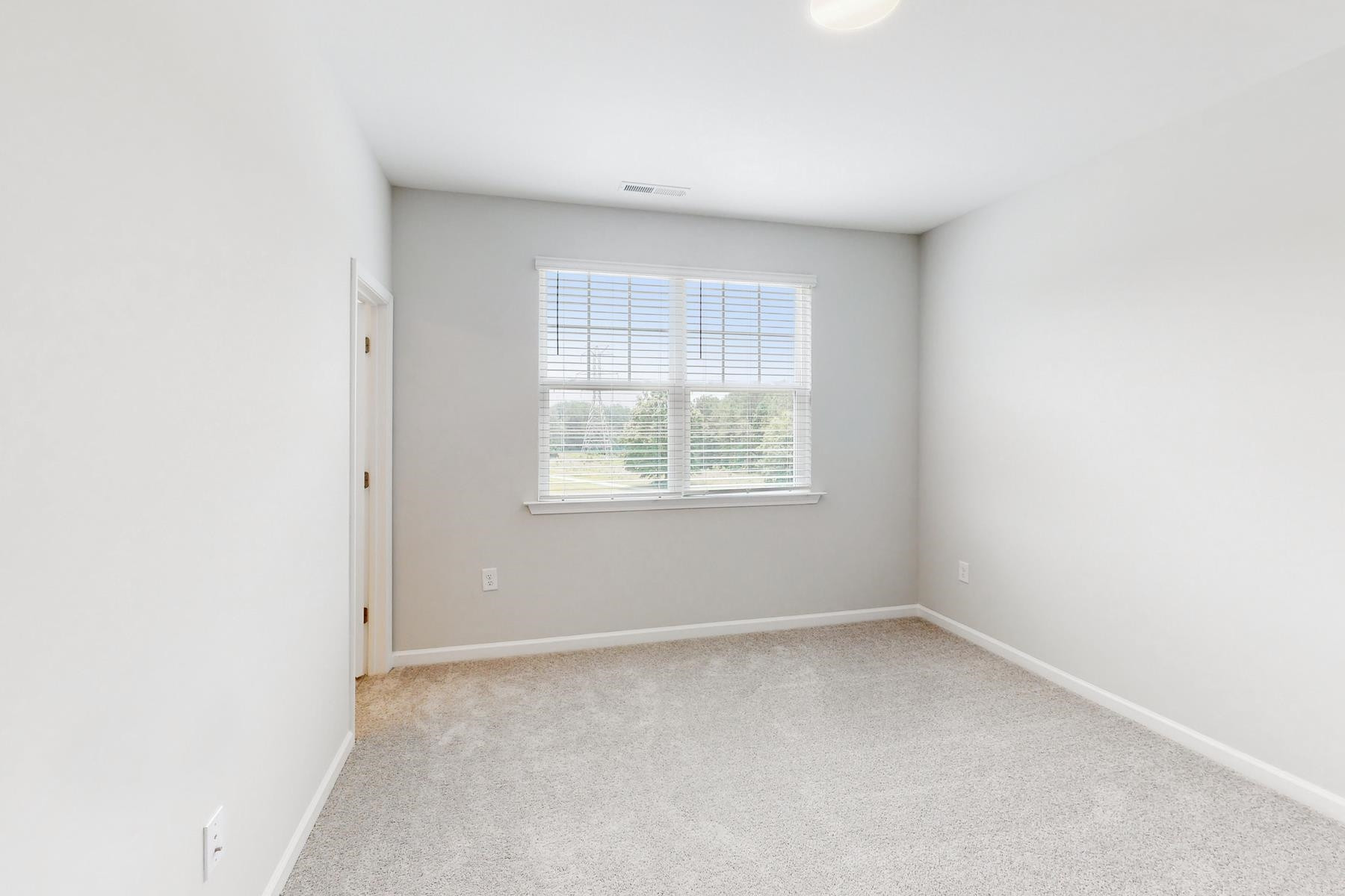 1007 Harmony Trail, Unit 16 Durham, NC 27703 - Photo 30 of 37 an empty room with a window