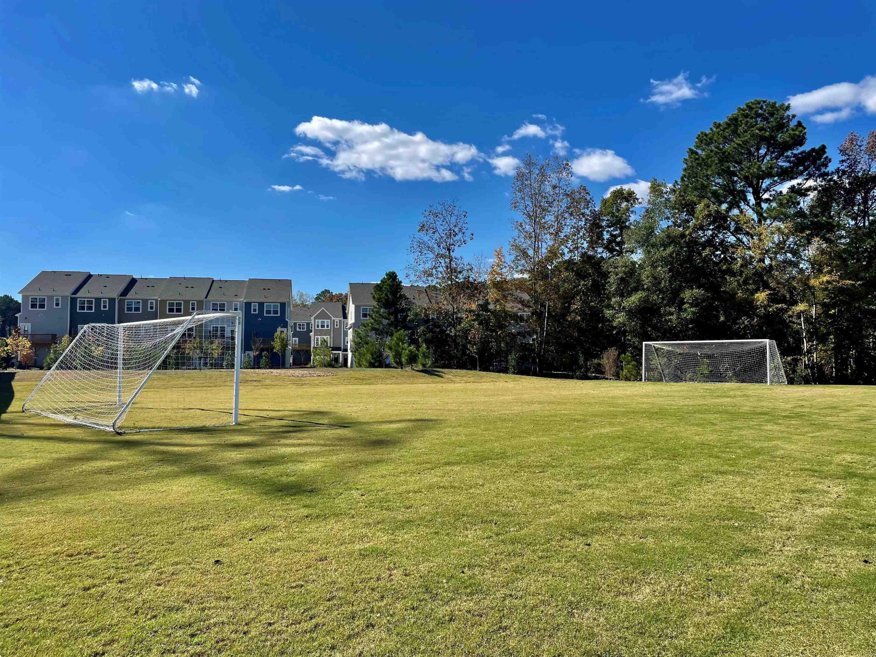 1007 Harmony Trail, Unit 16 Durham, NC 27703 - Photo 33 of 37 a view of a swimming pool with an outdoor space and seating area
