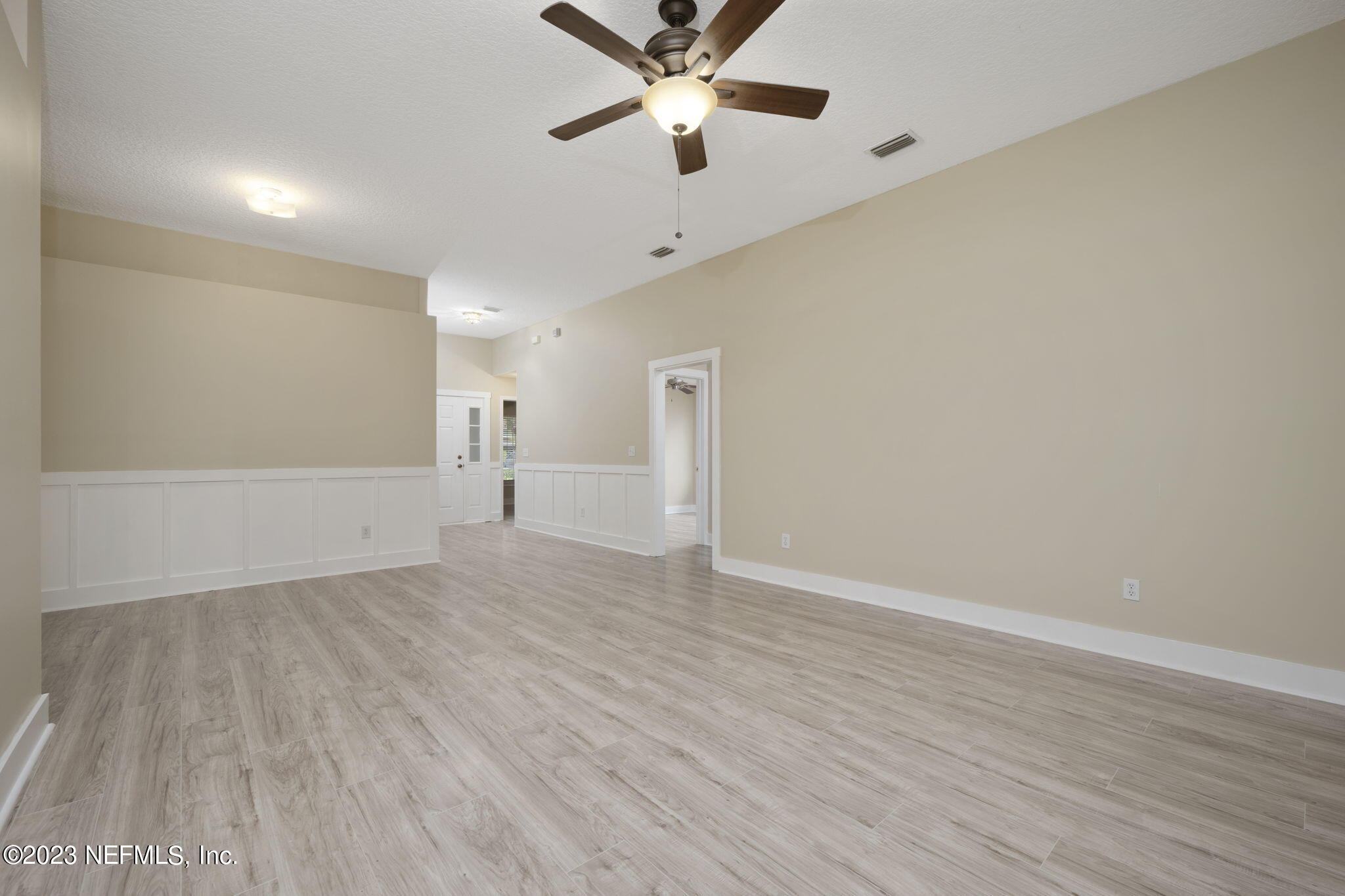 1040 Three Forks Court St. Augustine, FL 32092 - Photo 11 of 58 wooden floor in an empty room with a ceiling fan