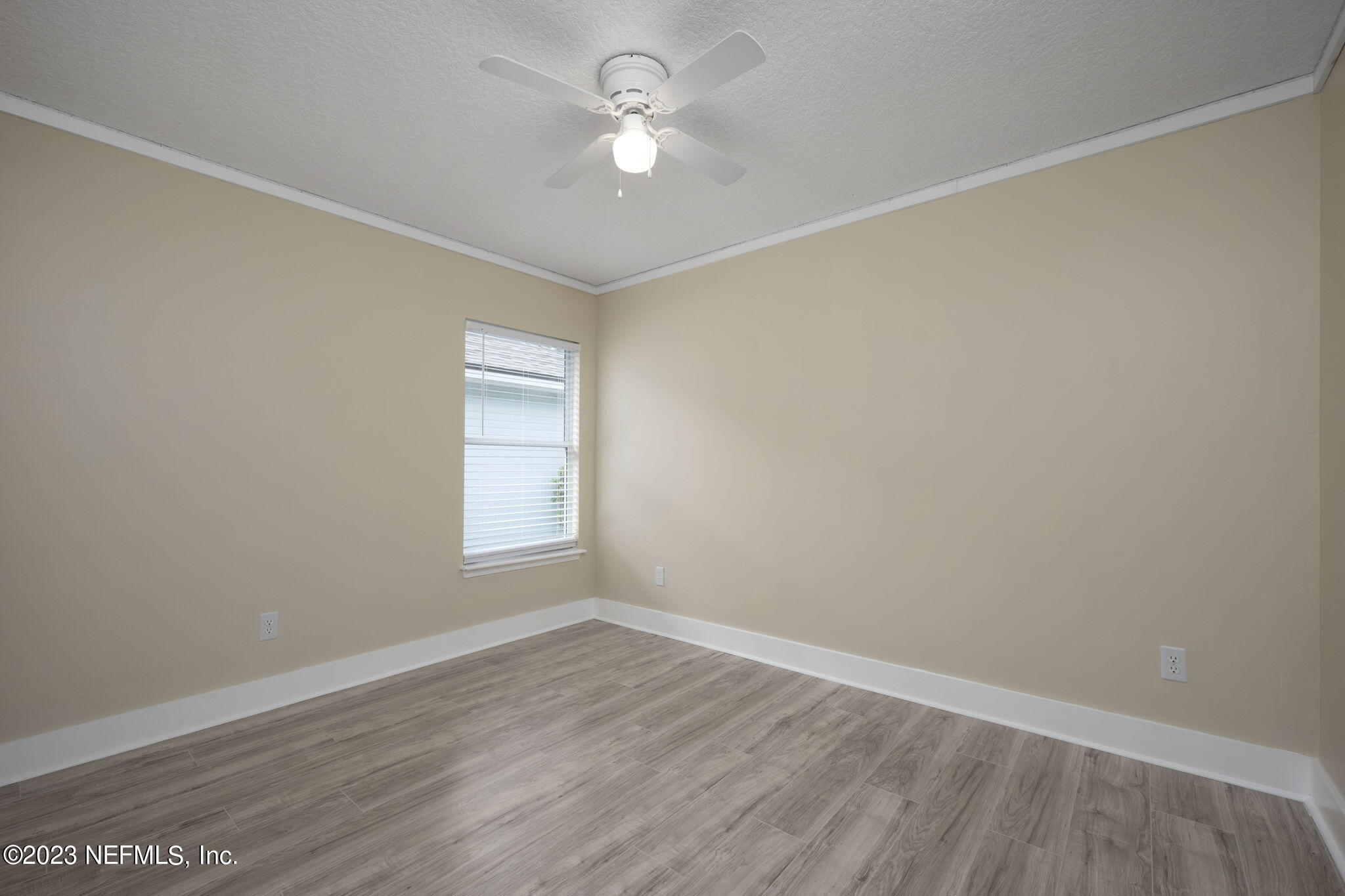 1040 Three Forks Court St. Augustine, FL 32092 - Photo 16 of 58 wooden floor in an empty room with a window