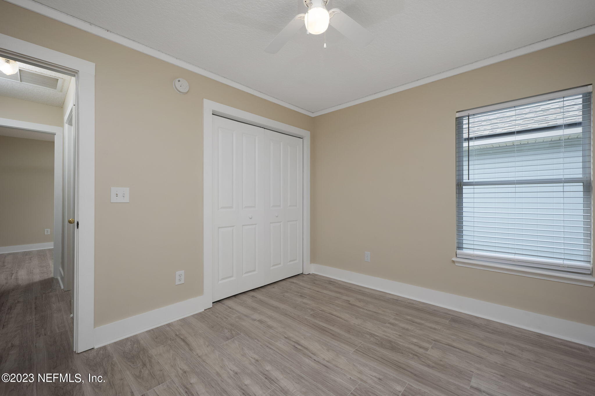 1040 Three Forks Court St. Augustine, FL 32092 - Photo 17 of 58 a view of an empty room with wooden floor and a window