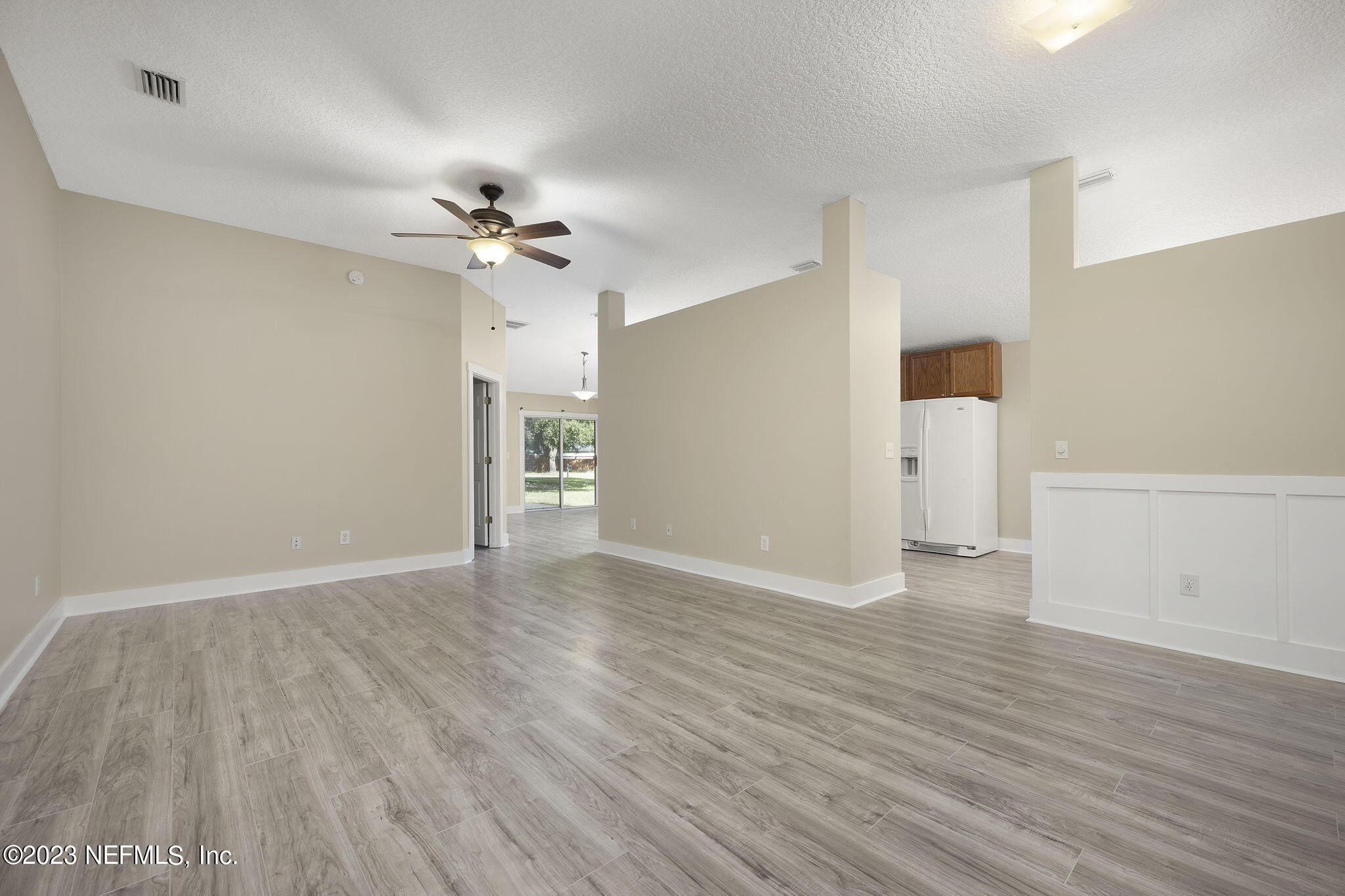 1040 Three Forks Court St. Augustine, FL 32092 - Photo 18 of 58 wooden floor in an empty room with a window